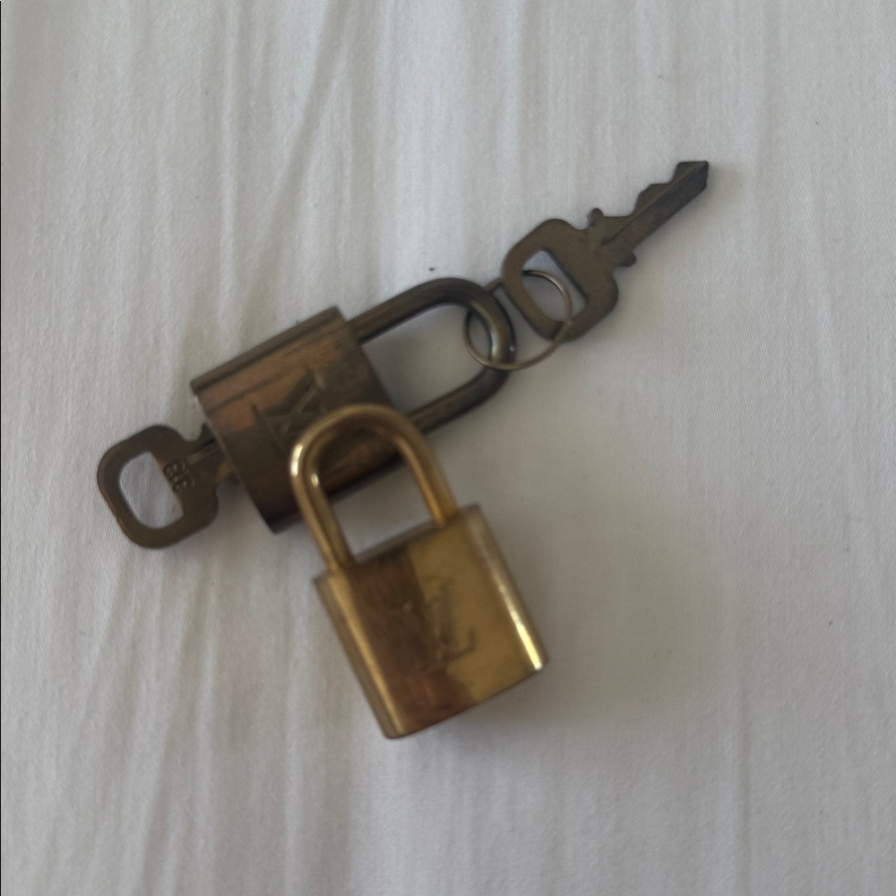 LV Gold and Bronze Padlocks with Keys
ONE W/ 2 keys and one w/ no key